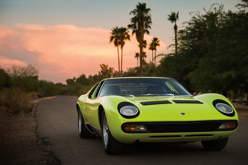 Lime green sports car at sunset