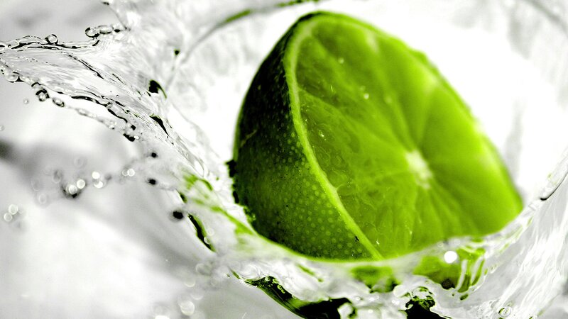 Lime Slice in Water — Photograph, White