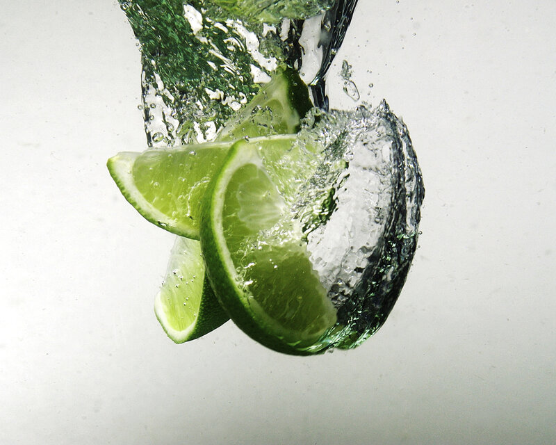 lime slices splashing in water