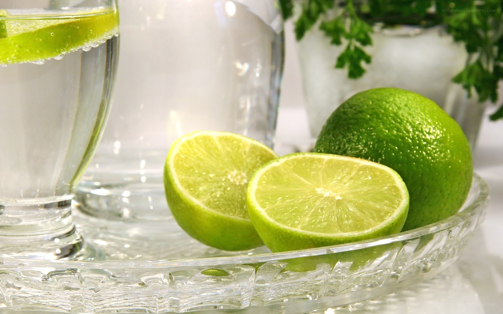 Limes and water on a tray
