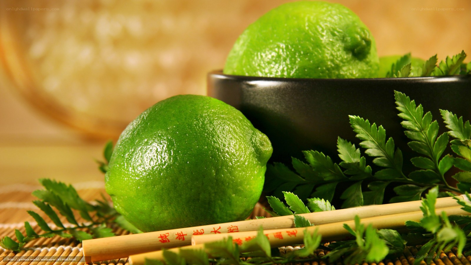 Limes with chopsticks and herbs