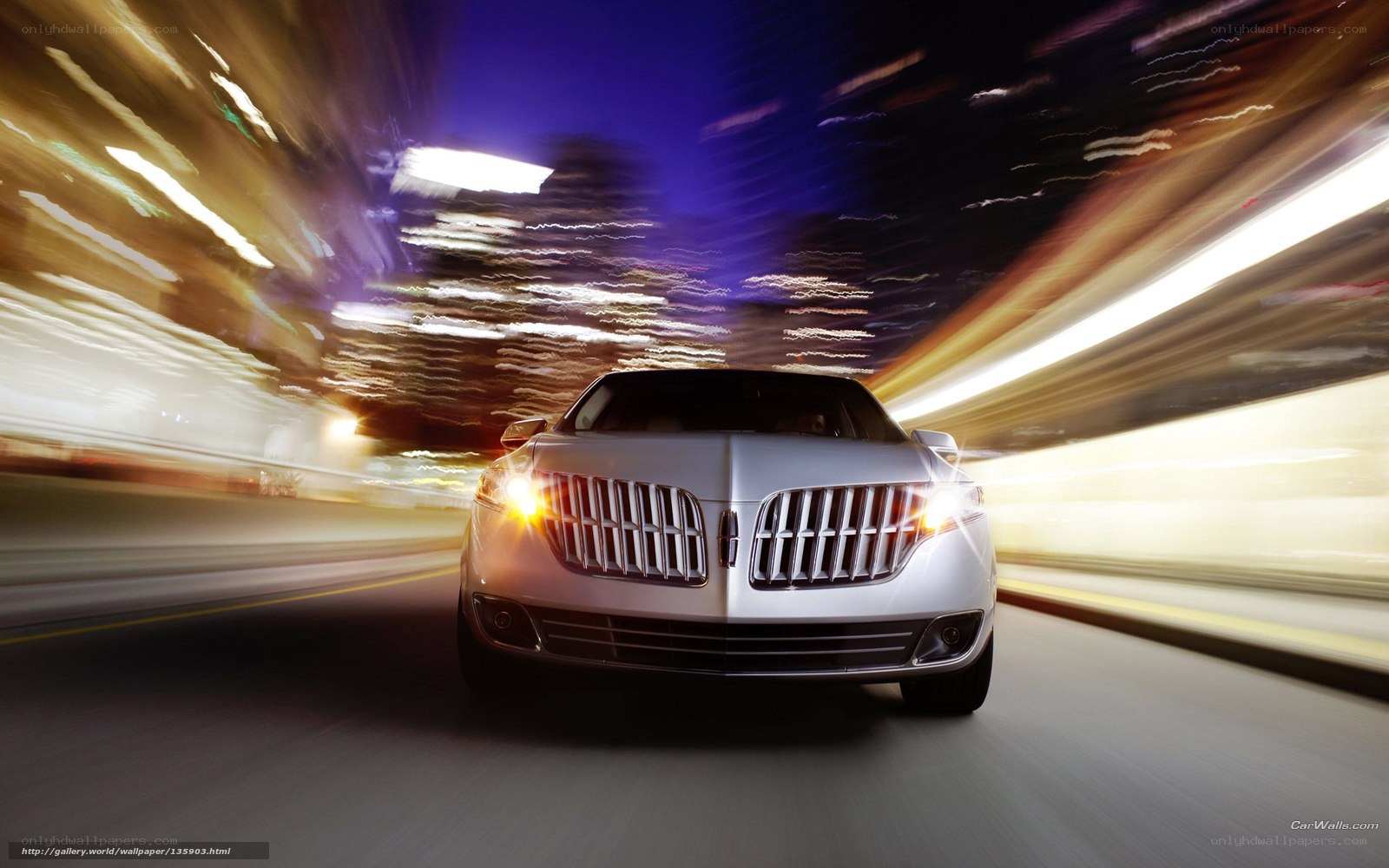 Lincoln car at night in motion