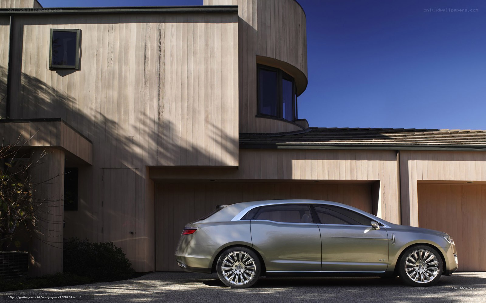 Lincoln concept car in front of modern house