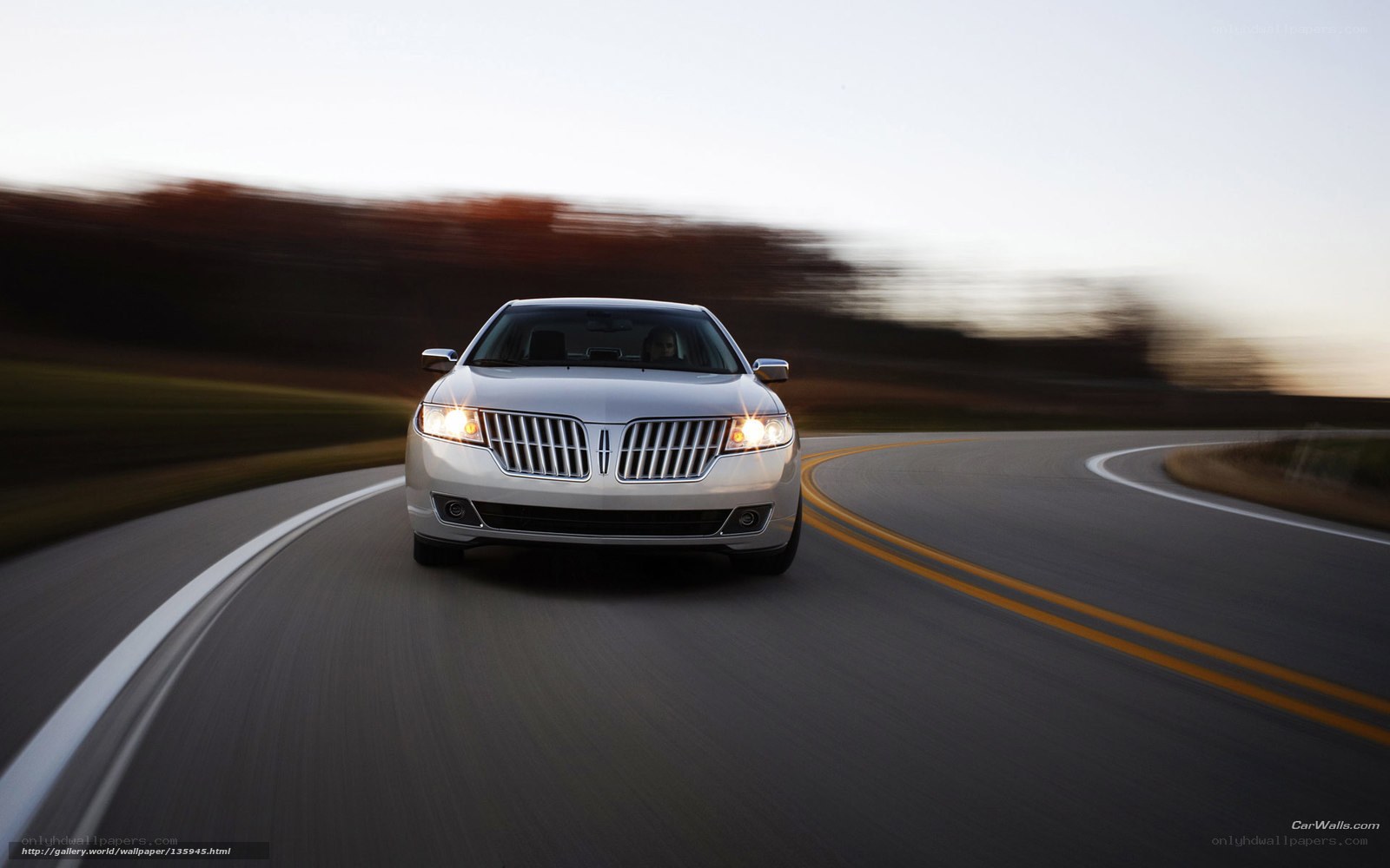 Lincoln sedan on winding road