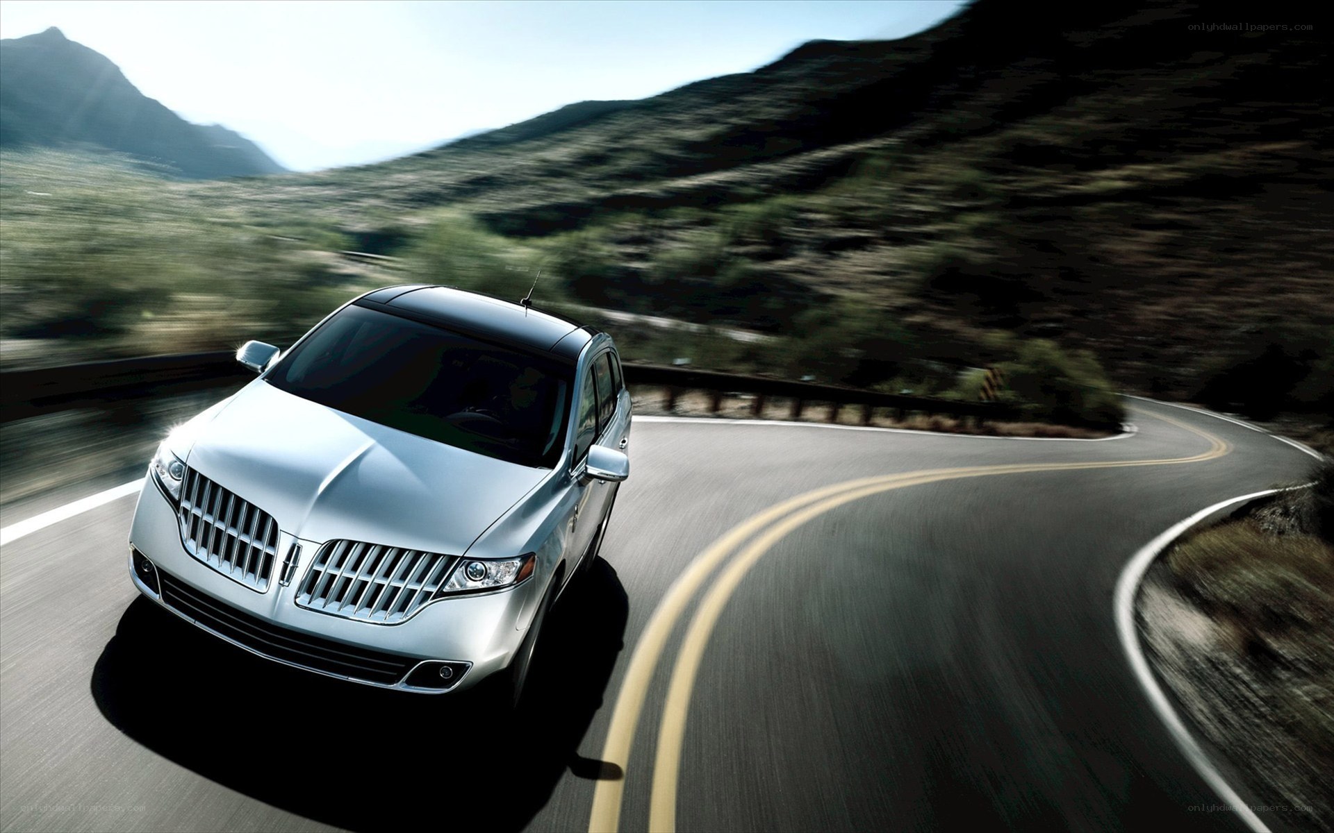 Lincoln SUV on winding road