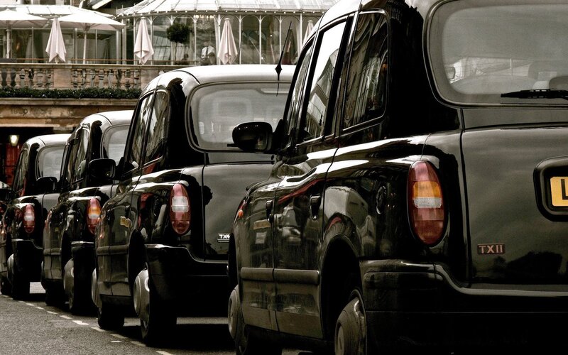line of black taxis