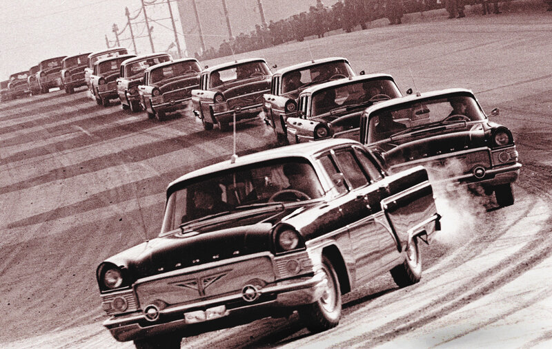 Line of vintage cars on track
