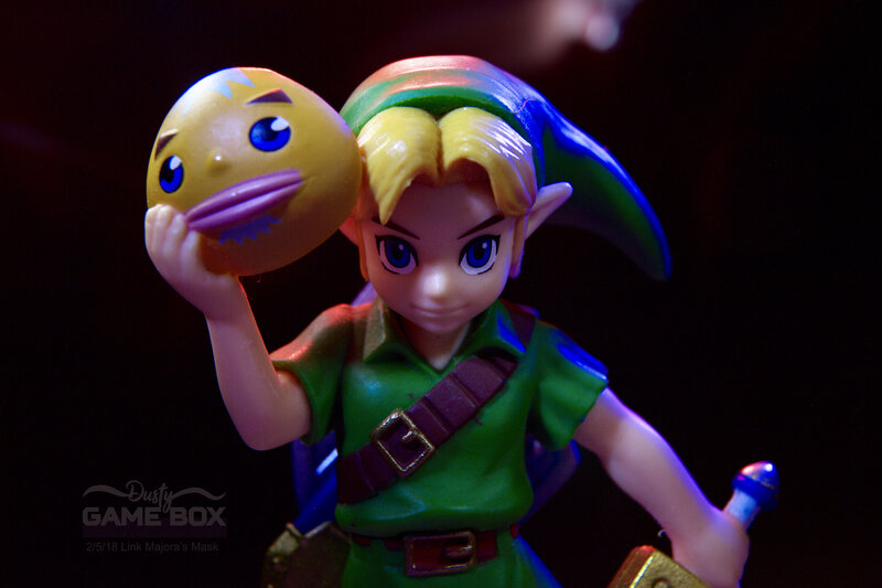 Link Holding a Mask — Green, Dramatic, Photograph