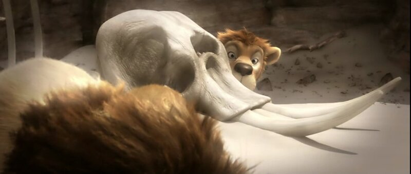 Lion Cub Behind Skull