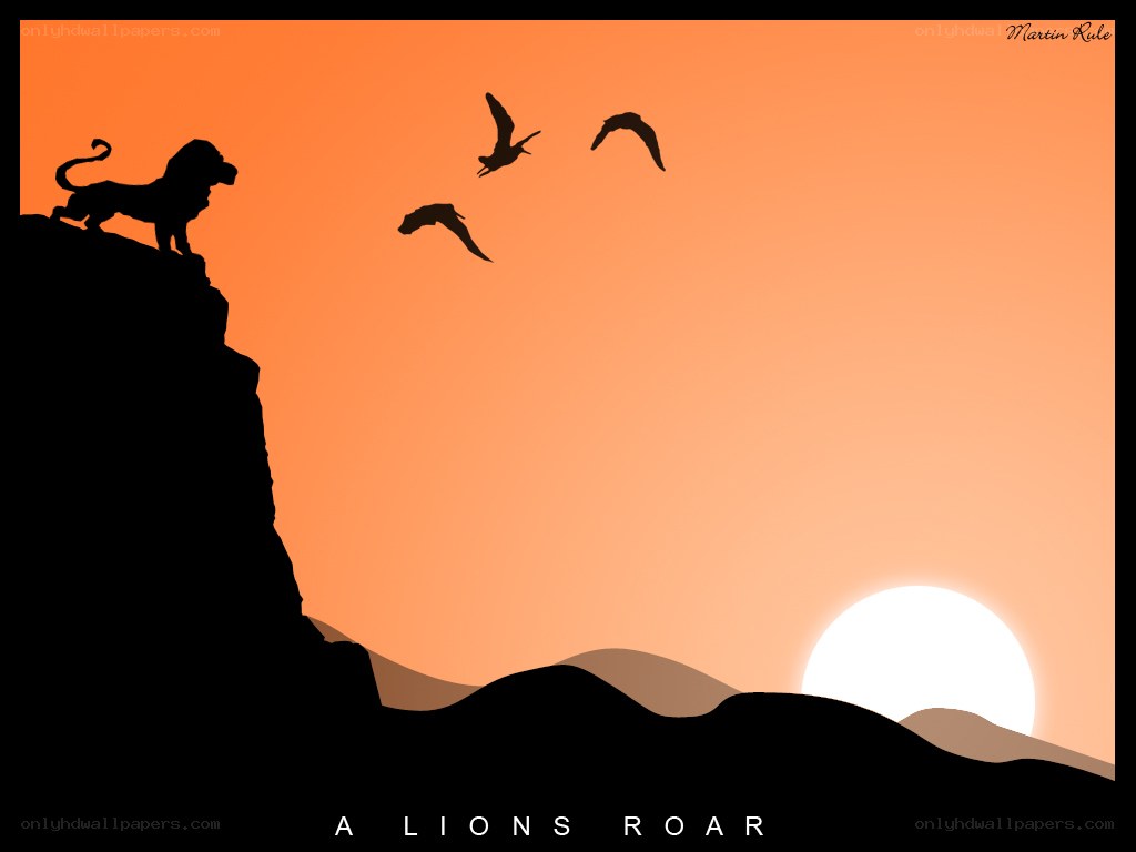 lion on a cliff at sunset