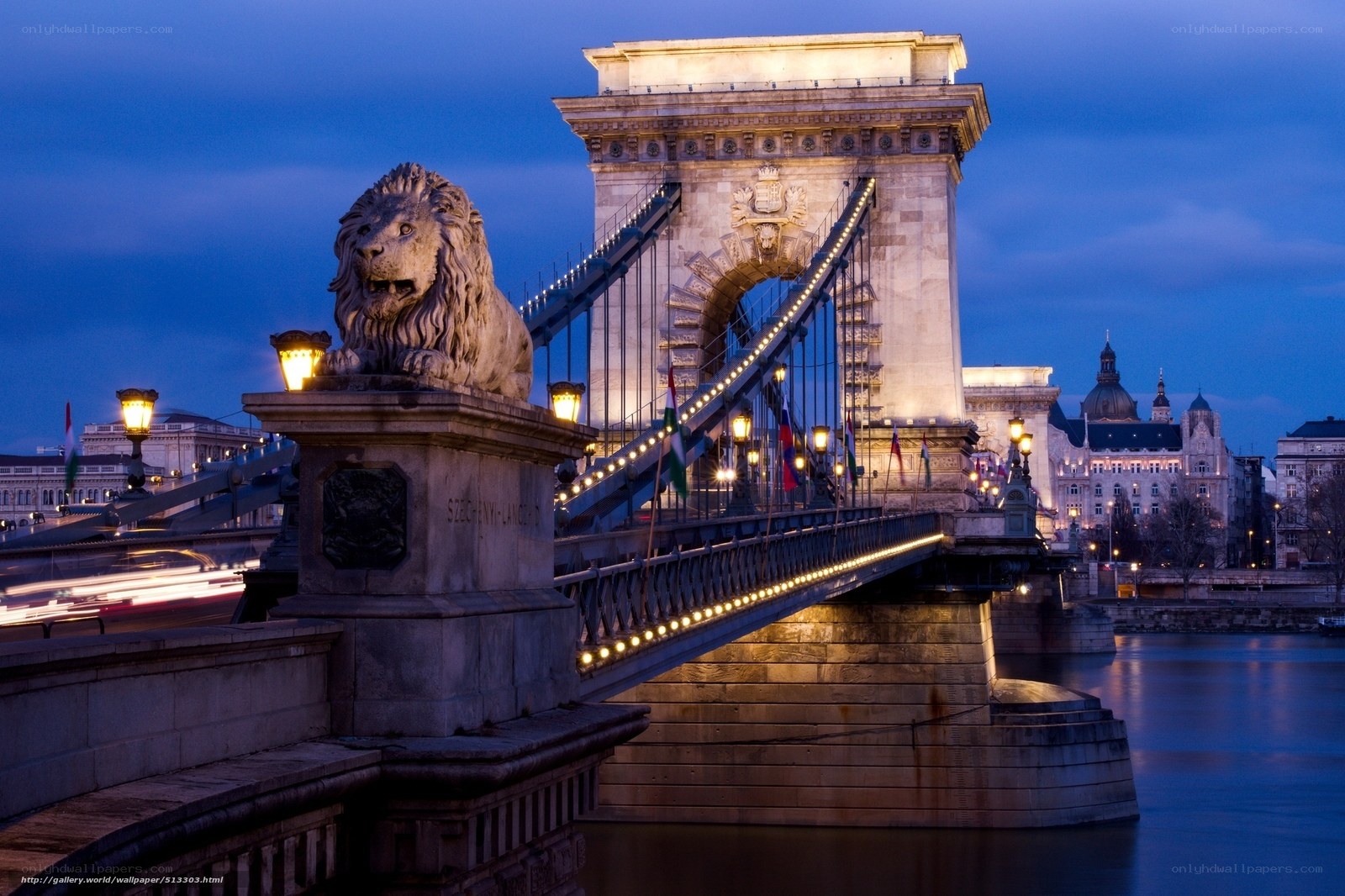 Lion statue on bridge at dusk