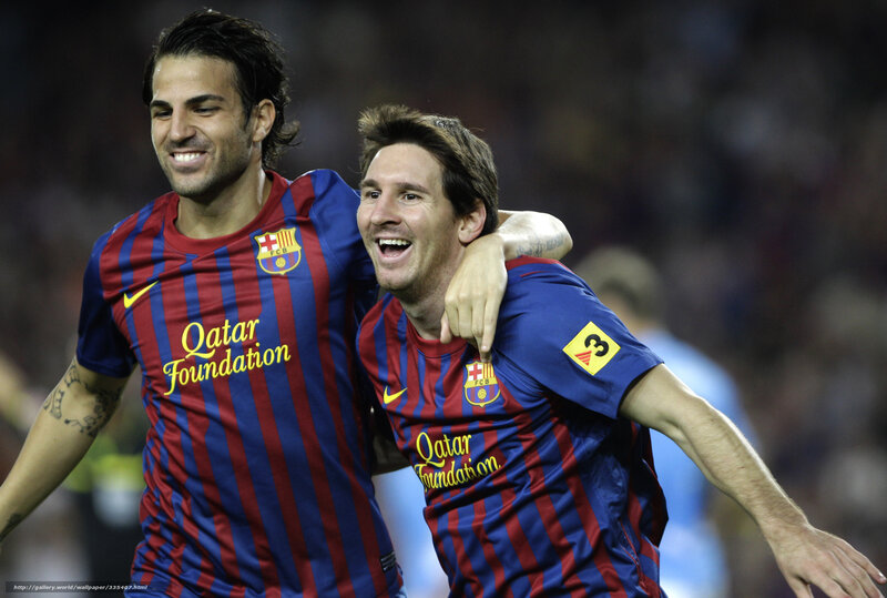 Lionel Messi and Cesc Fabregas celebrate