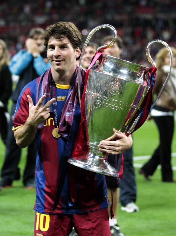 Lionel Messi with Champions League trophy