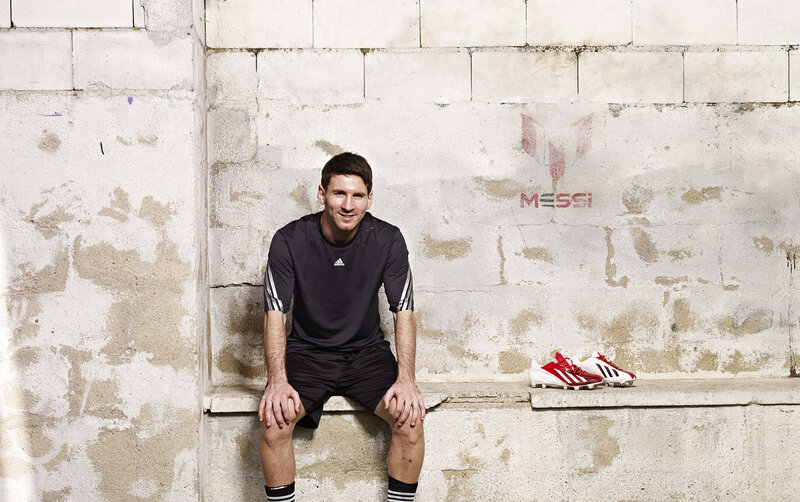 Lionel Messi with football boots