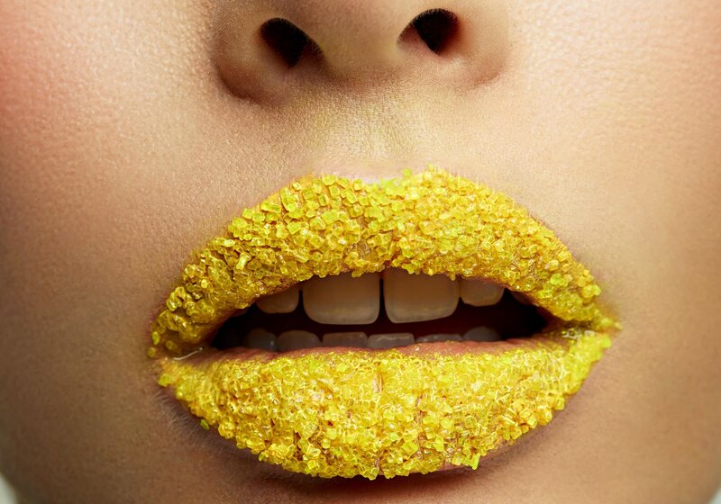 Lips Covered in Yellow Sugar