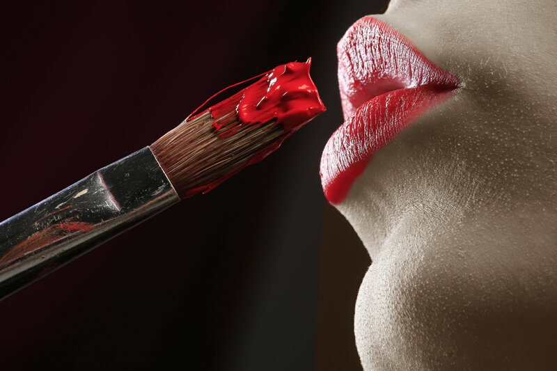 Lipstick being applied with a brush