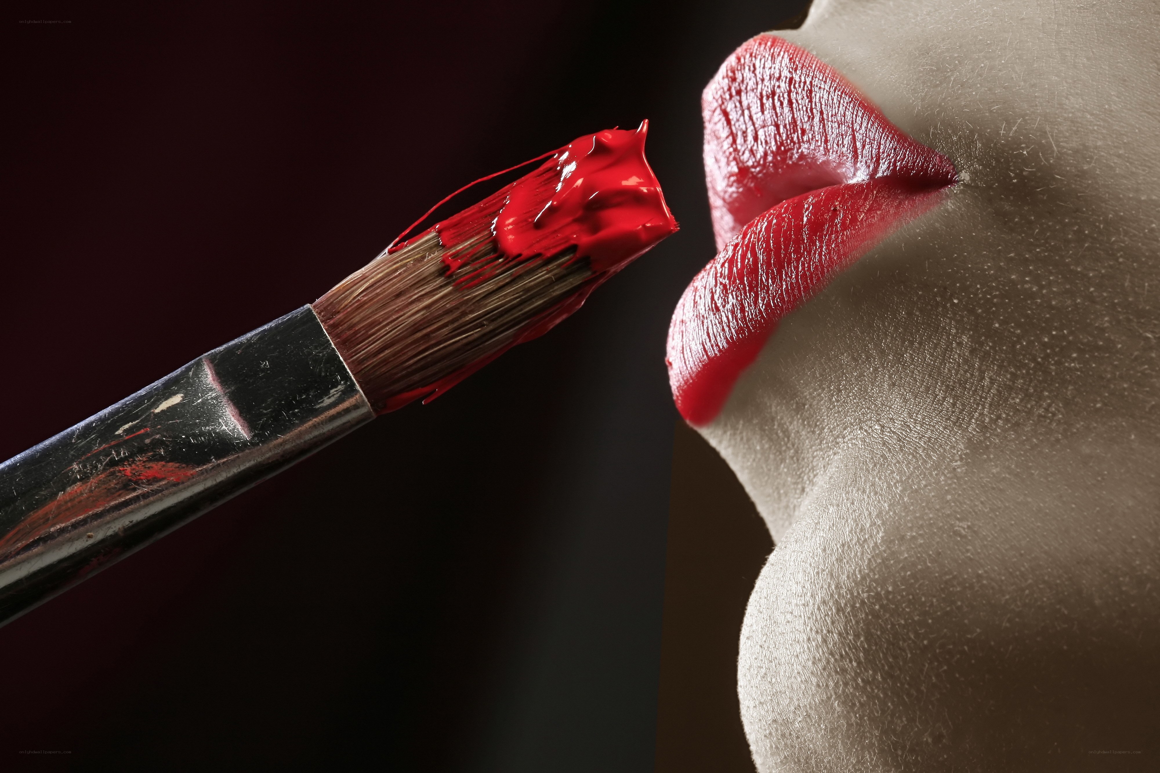 Lipstick being applied with a brush