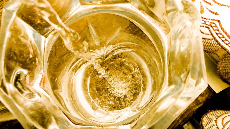Liquid Being Poured into Glass — Gold