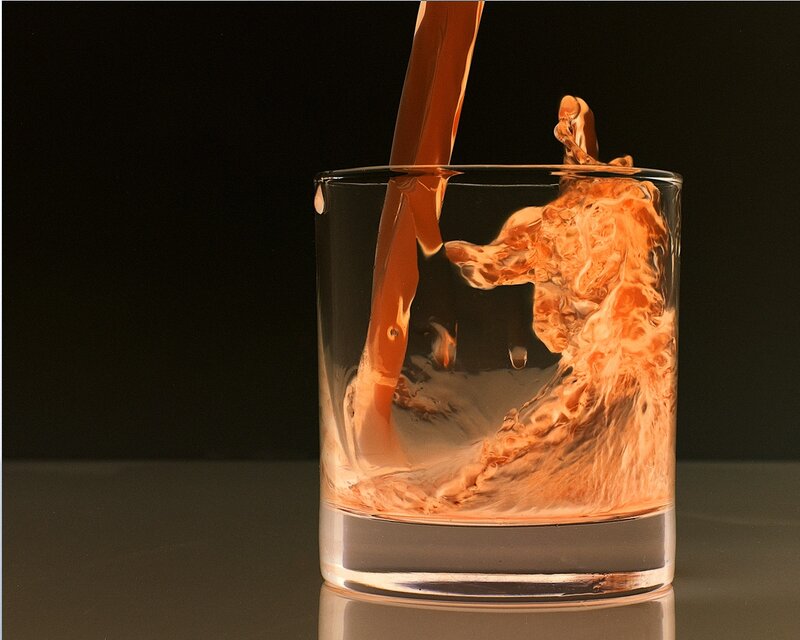 liquid being poured into glass