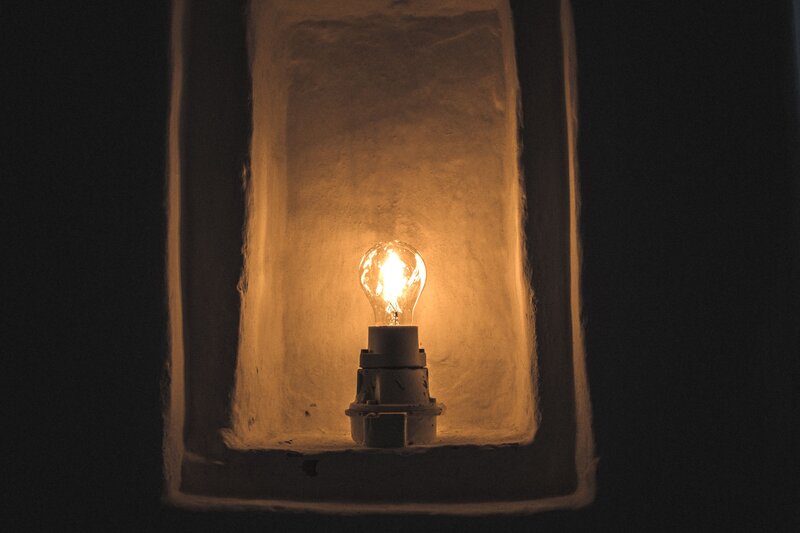 lit bulb in a niche