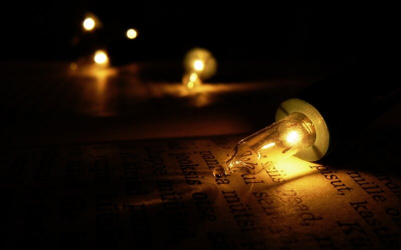 Lit Bulb on Book Page
