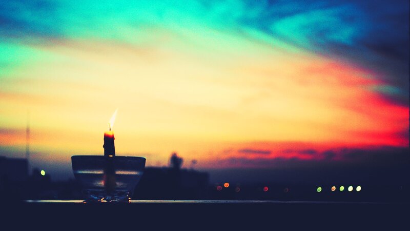 Lit Candle at Dusk — Orange