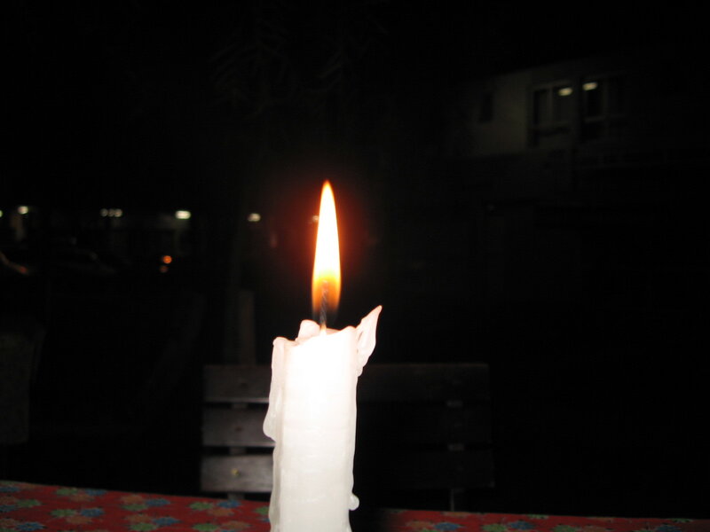 lit candle at night