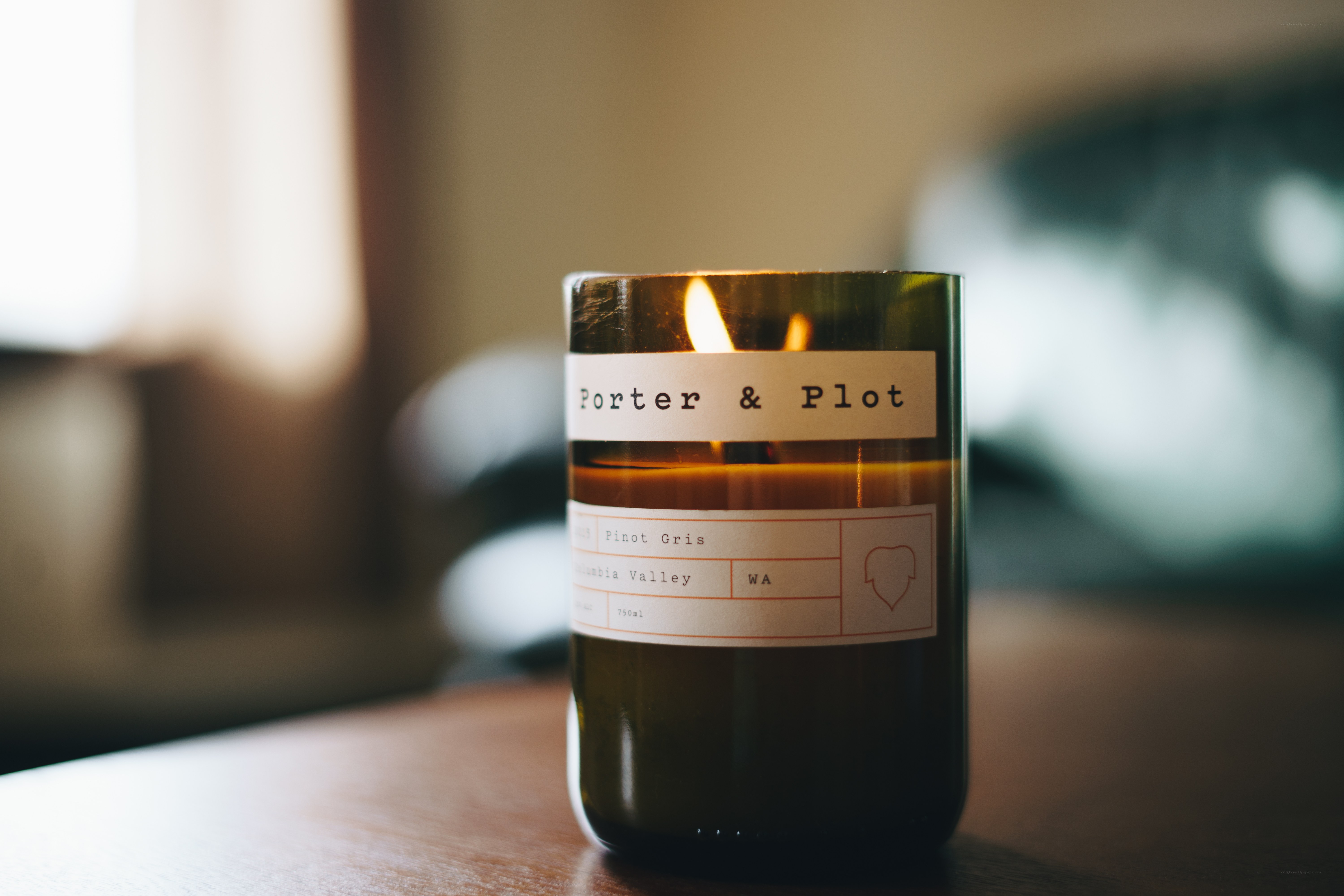 lit candle in a glass jar