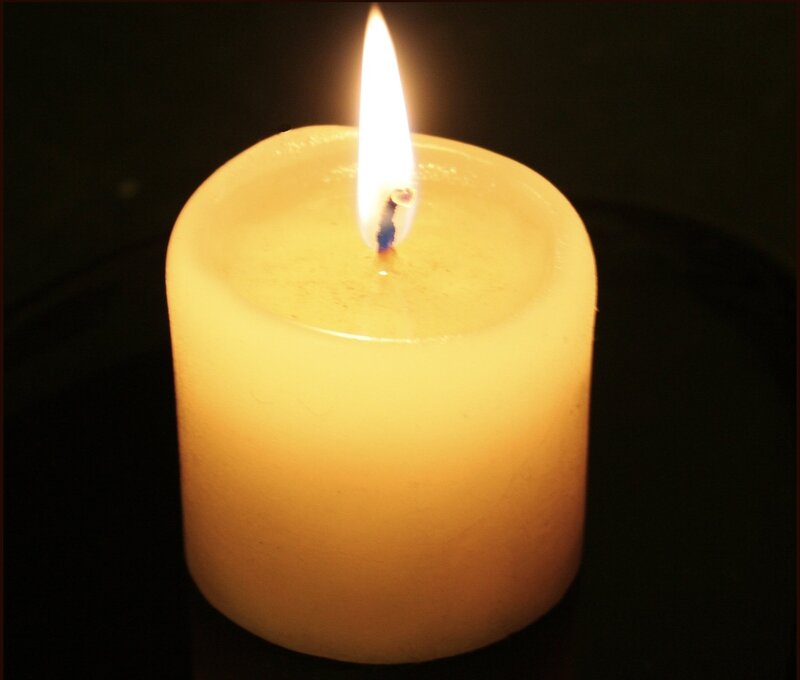 Lit Candle in Darkness — Yellow
