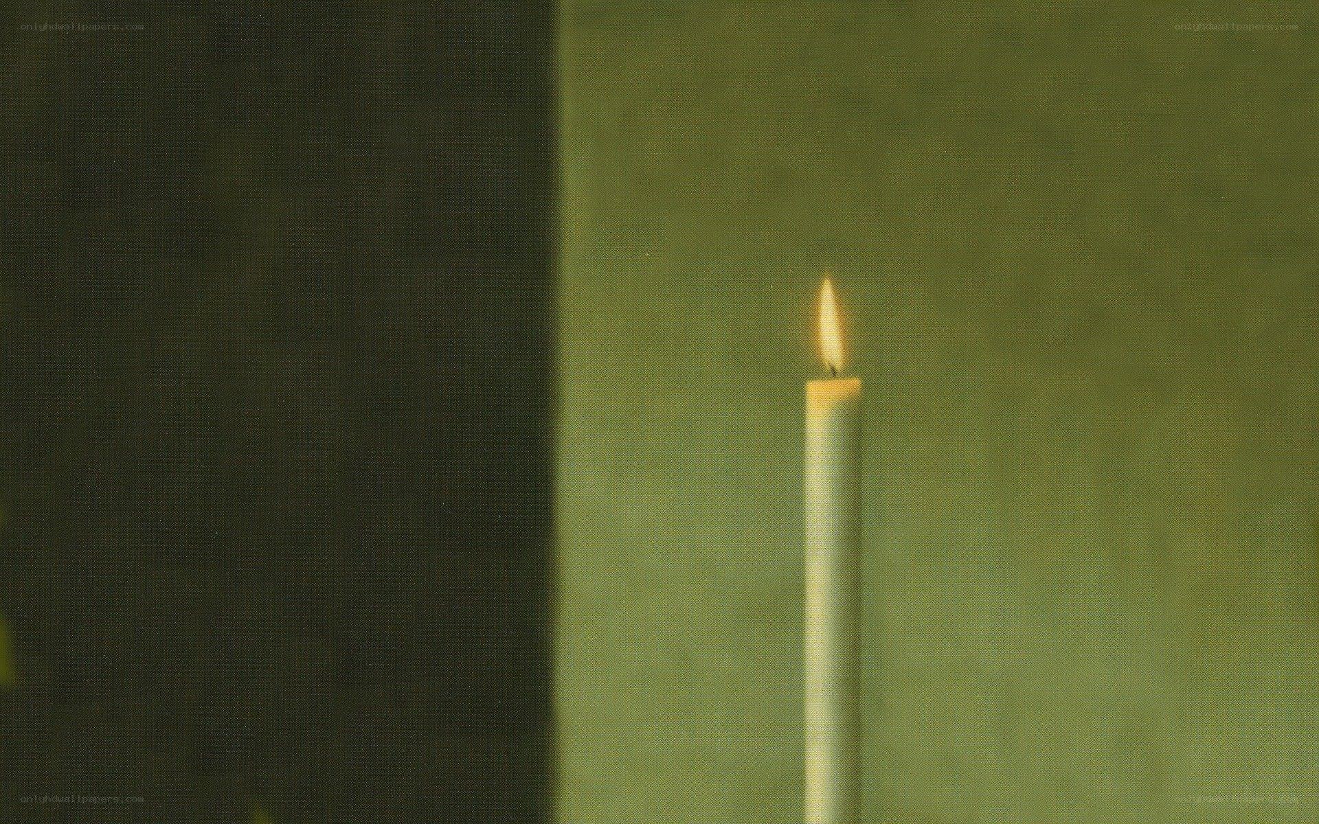 lit candle in dim light