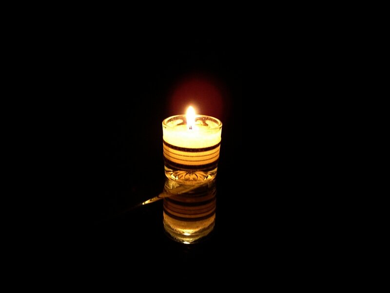 Lit Candle in Glass — Black