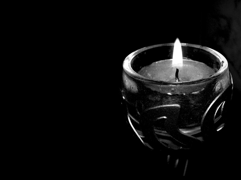 Lit Candle in Glass Holder — Black