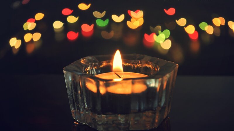 Lit Candle in Glass Holder — Yellow