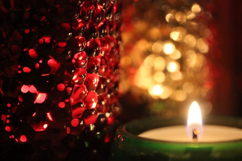 Lit Candle in Green Holder