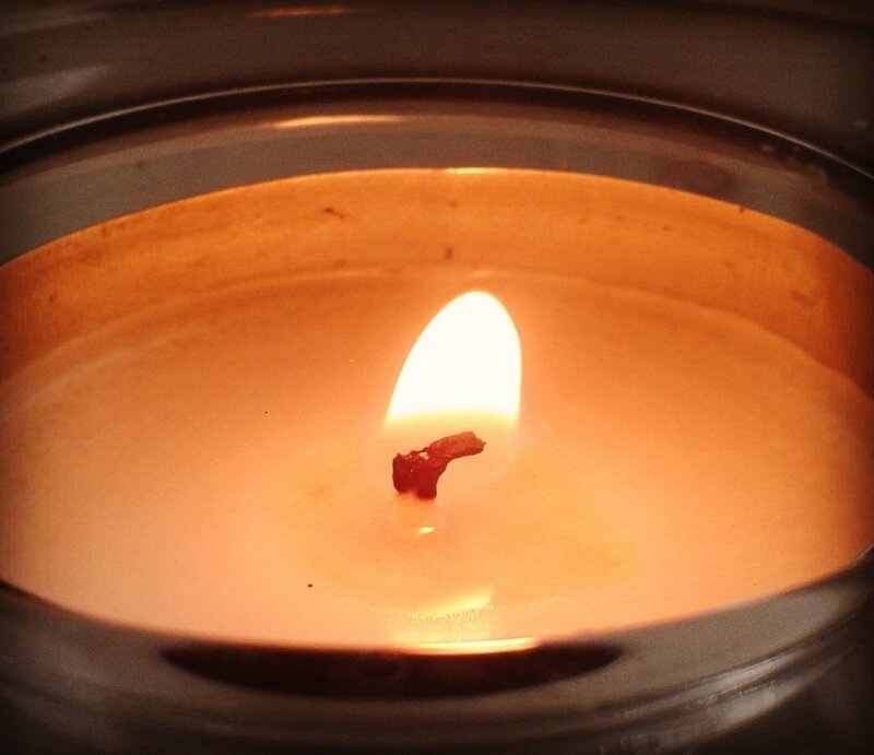 Lit Candle in Holder — Orange