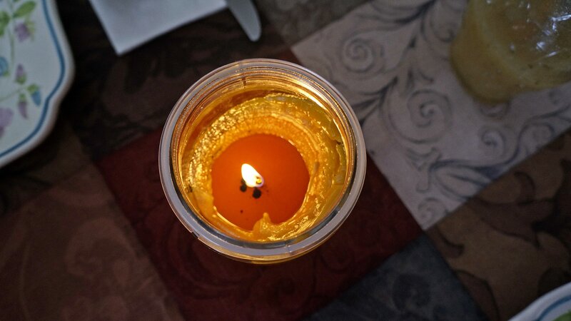 Lit Candle in Jar — Orange