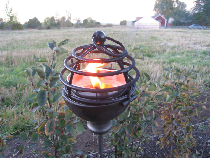 Lit Candle in Metal Holder