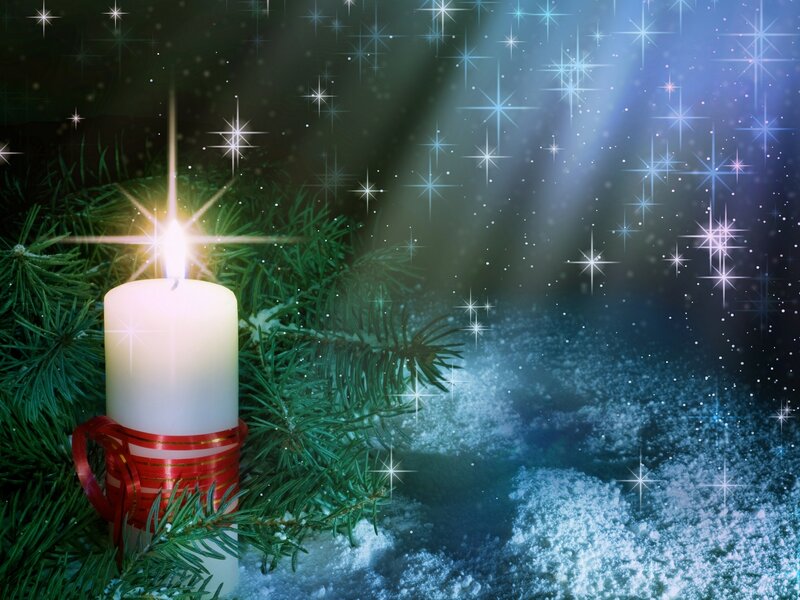 Lit Candle in Snow