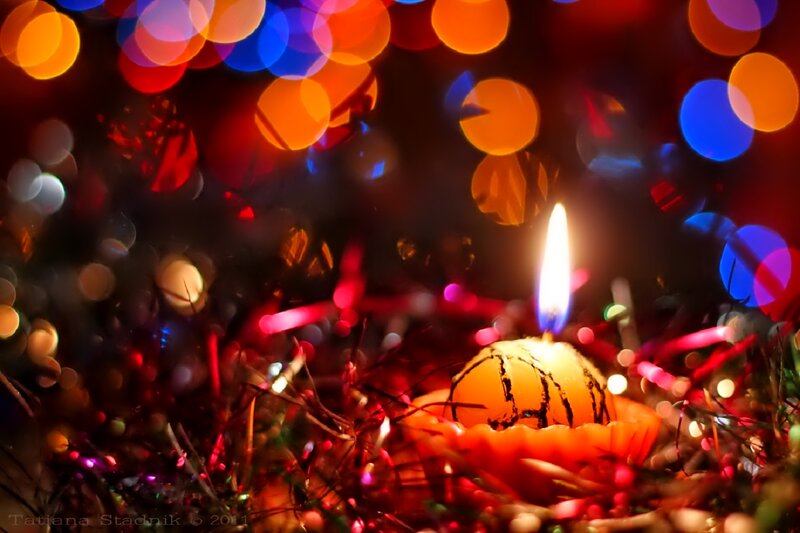 Lit Candle in Tinsel