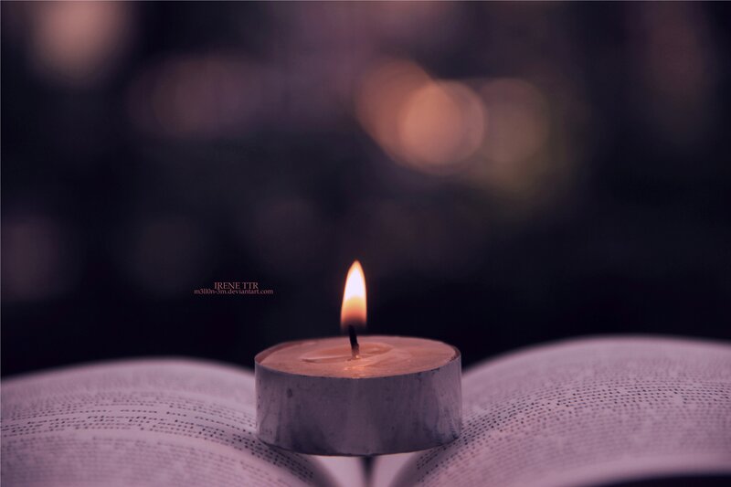 Lit Candle on Book — Purple