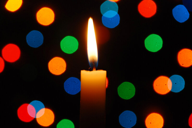 Lit Candle with Bokeh Lights