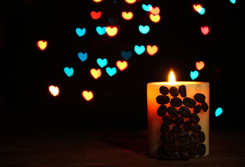 Lit Candle with Coffee Beans