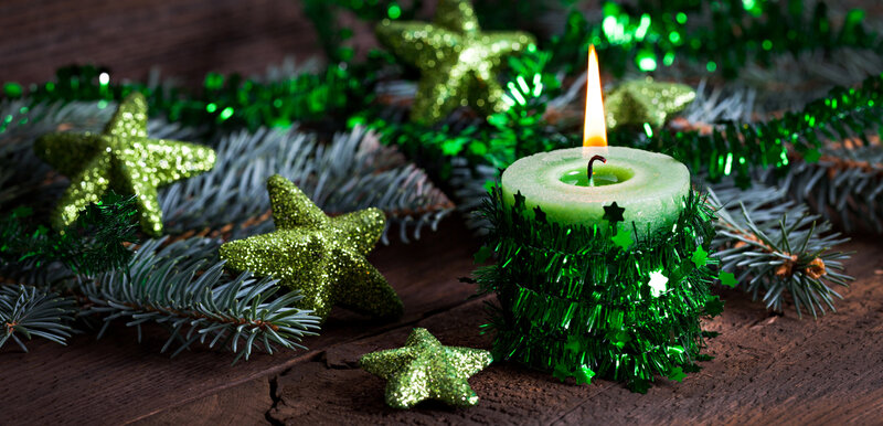 Lit Candle with Green Tinsel