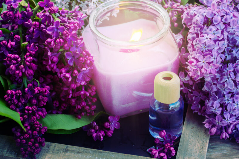 Lit Candle with Lilacs