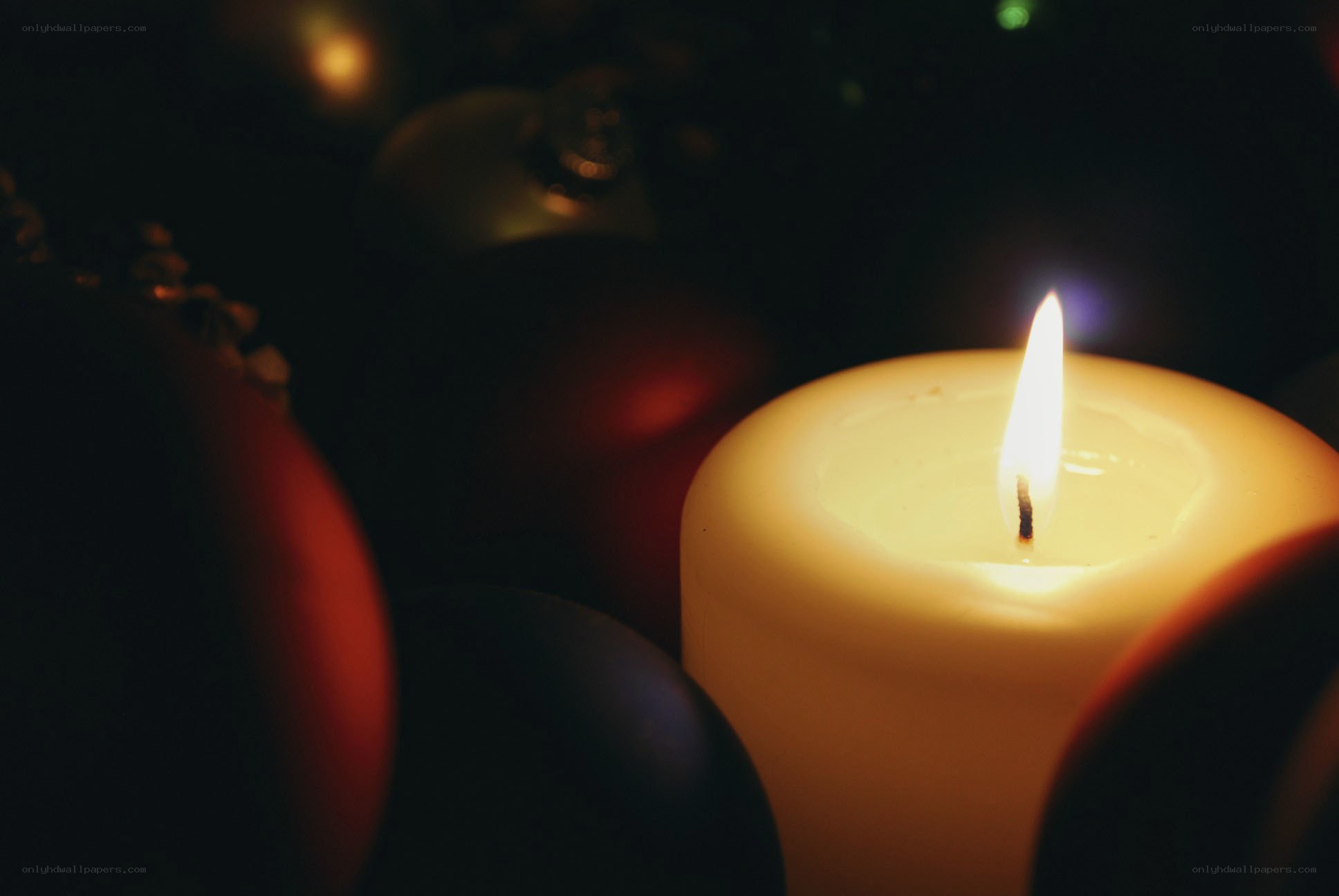 lit candle with ornaments