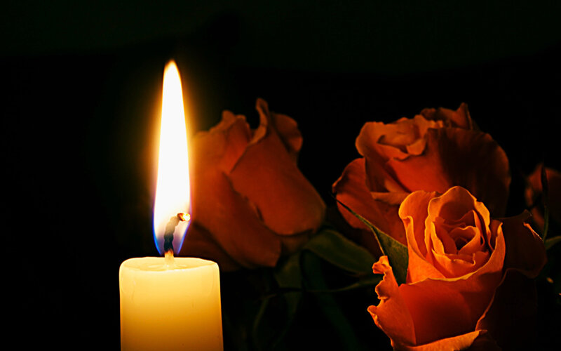 Lit Candle with Roses
