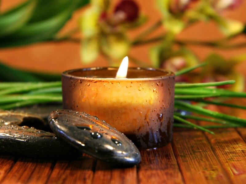 Lit Candle with Stones