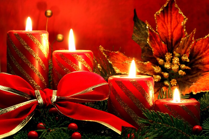 Lit Candles and Poinsettia