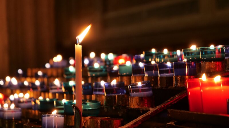 Lit Candles in a Church