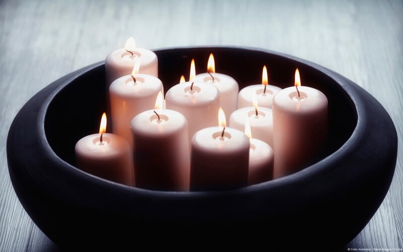 Lit Candles in Bowl
